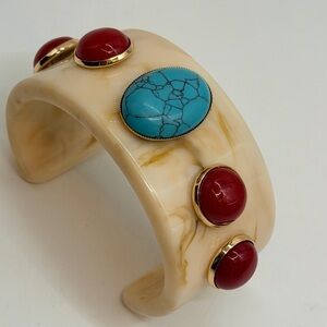 Cream Resin Cuff Bracelet with turquoise and red stone embellishments.